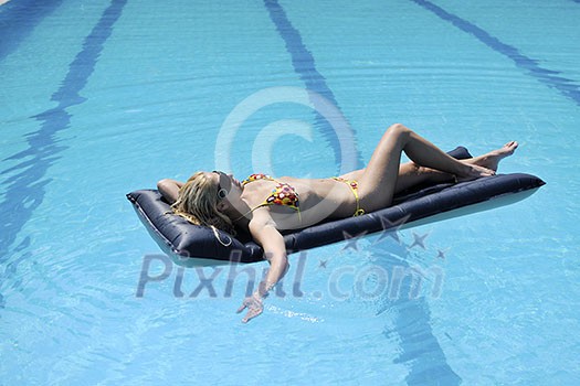 beautiful young woman relax and have fun at swimming pool beautiful young woman relax and have fun at swimming pool