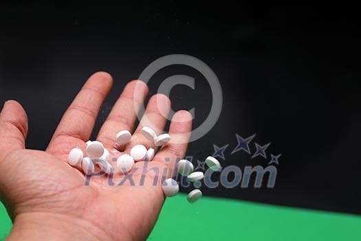 pills in human hand pills in human hand