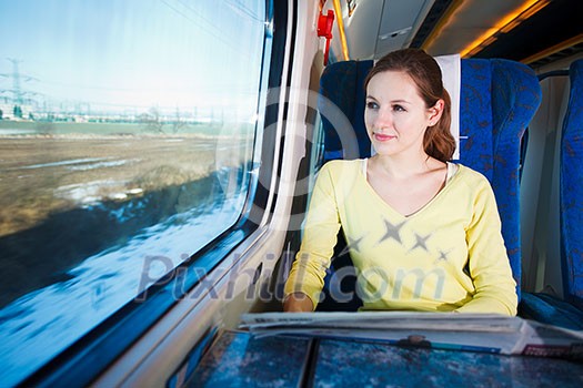 Young woman traveling by train