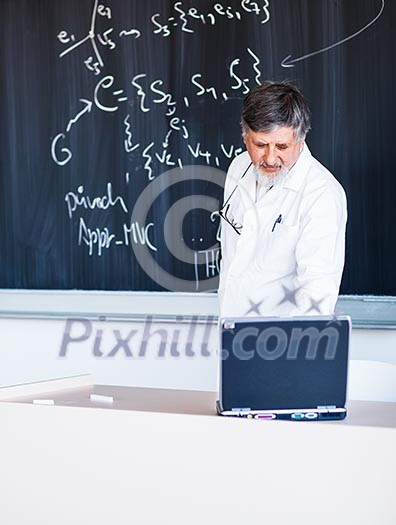 Senior chemistry professor writing on the board while having a chalk and blackboard lecture (shallow DOF; color toned image) Senior chemistry professor writing on the board while having a chalk and blackboard lecture (shallow DOF; color toned image)
