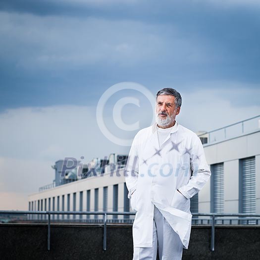 Renowned scientist/doctor standing on the roof of the research center/hospital looking confident (color toned image) Renowned scientist/doctor standing on the roof of the research center/hospital looking confident (color toned image)