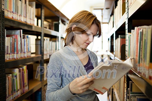 pretty female college student in a llibrary (color toned image)