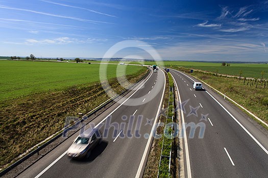 highway traffic on a lovely, sunny summer day highway traffic on a lovely, sunny summer day