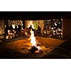 Cosy fireplace in a mountain chalet's warm, wooden interior