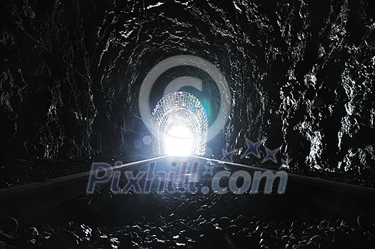 light on end of train tunnel representing new life and success concept light on end of train tunnel representing new life and success concept