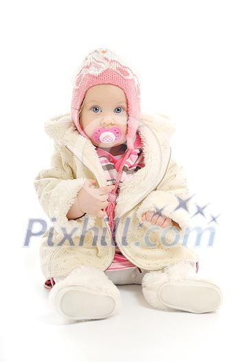 cute happy little baby with winter hat and coat isolated on white