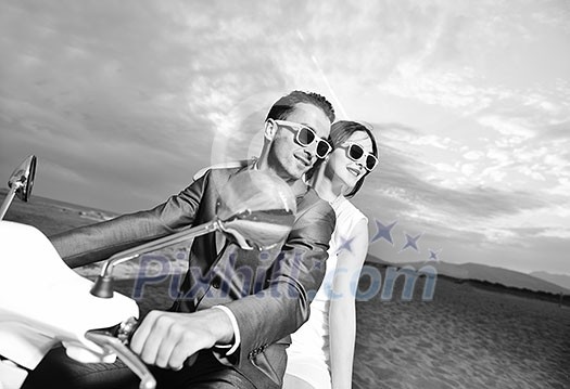 wedding sce of bride and groom just married couple on the beach ride white scooter and have fun wedding sce of bride and groom just married couple on the beach ride white scooter and have fun