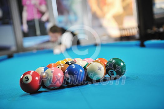 young pro billiard player finding best solution and right angle at billard or snooker pool sport  game 