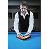 young pro billiard player finding best solution and right angle at billard or snooker pool sport  game 