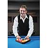 young pro billiard player finding best solution and right angle at billard or snooker pool sport  game 