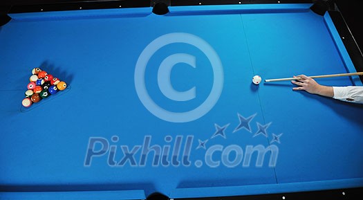 young pro billiard player finding best solution and right angle at billard or snooker pool sport  game 