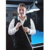 young pro billiard player finding best solution and right angle at billard or snooker pool sport  game 