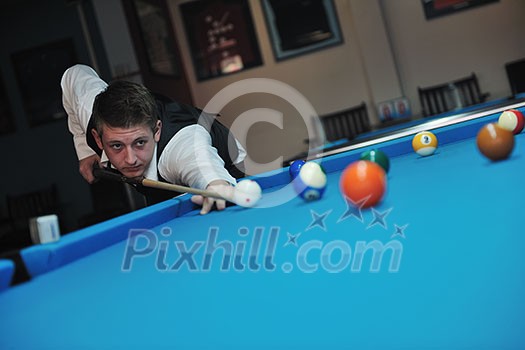 young pro billiard player finding best solution and right angle at billard or snooker pool sport  game 