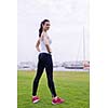 Young beautiful  woman jogging and running  on morning at  park in the city. Woman in sport outdoors health and fitness concept