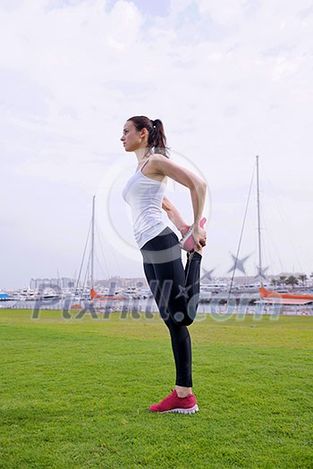 Young beautiful  woman jogging and running  on morning at  park in the city. Woman in sport outdoors health and fitness concept