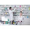 team of  pharmacist chemist woman group  standing in pharmacy drugstore