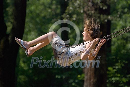 happy girl swinging   (NIKON D80; 10.6.2007; 1/1000 at f/6.3; ISO 400; white balance: Auto; focal length: 270 mm)