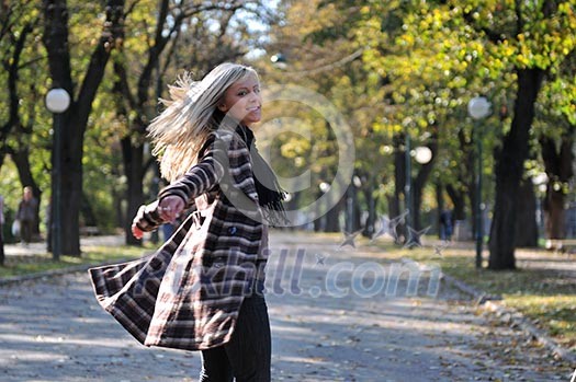 Cute young woman smiling outdoors in nature Cute young woman smiling outdoors in nature
