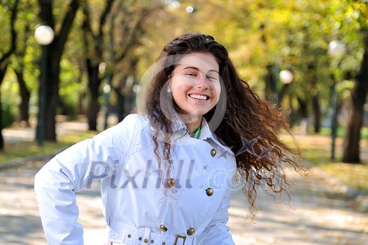 brunette Cute young woman smiling outdoors in nature brunette Cute young woman smiling outdoors in nature