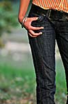 woman torso jeans leg stomach outdoor