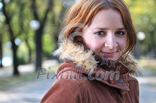 brunette Cute young woman with piercing posing outdoors in nature