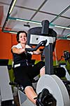 Young woman working out in fitness