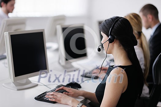 business people group with  headphones giving support in  help desk office to customers, manager giving training and education instructions