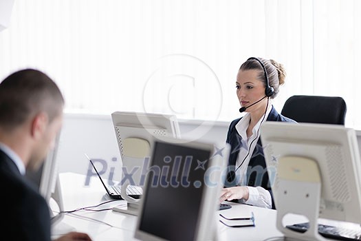 business people group with  headphones giving support in  help desk office to customers, manager giving training and education instructions