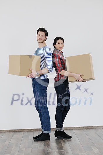 happy Young couple moving in new home happy Young couple moving in new home