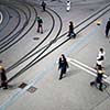 urban traffic concept - city street with a motion blurred crowd crossing a road