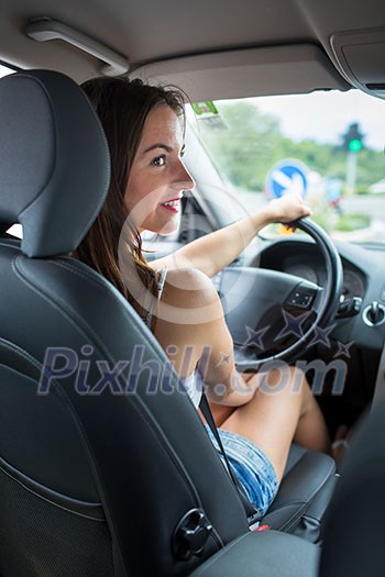 Young, woman driving a car, going home from work Young, woman driving a car, going home from work