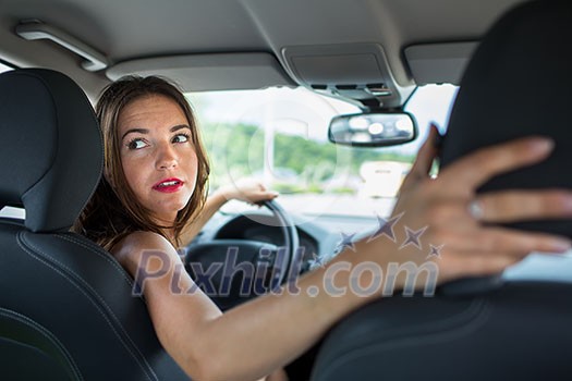 Young, woman driving a car, going home from work