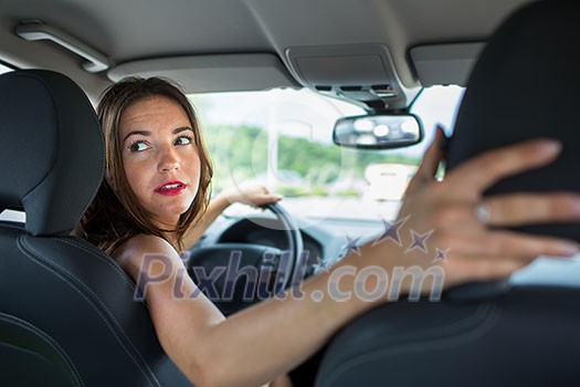 Young, woman driving a car, going home from work Young, woman driving a car, going home from work