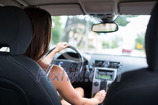 Young, woman driving a car, going home from work Young, woman driving a car, going home from work
