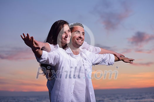 happy young romantic couple in love have fun on beautiful beach at beautiful summer day happy young romantic couple in love have fun on beautiful beach at beautiful summer day