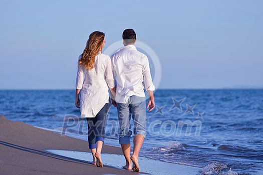 happy young romantic couple in love have fun on beautiful beach at beautiful summer day happy young romantic couple in love have fun on beautiful beach at beautiful summer day