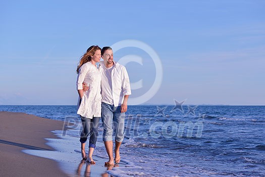 happy young romantic couple in love have fun on beautiful beach at beautiful summer day happy young romantic couple in love have fun on beautiful beach at beautiful summer day