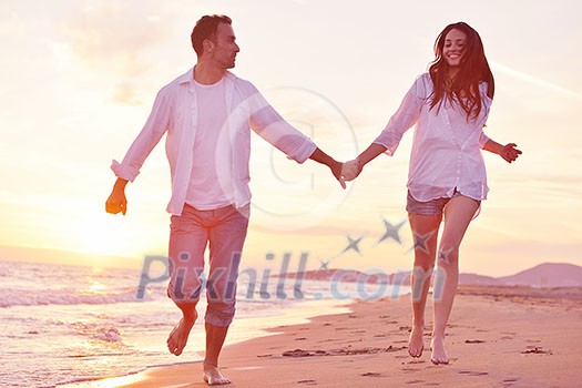 happy young romantic couple in love have fun on beautiful beach at beautiful summer day