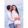 happy young romantic couple in love have fun on beautiful beach at beautiful summer day