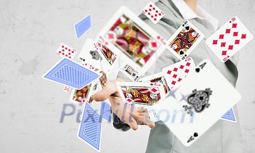 Close-up image of businesswoman throwing card deck