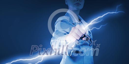 Image of powerful businesswoman holding lightning in fist Image of powerful businesswoman holding lightning in fist