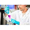 Young male researcher carrying out scientific research in a lab (shallow DOF; color toned image)