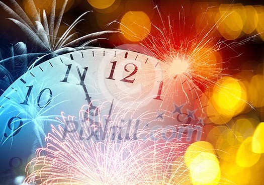 Conceptual image of clock with bokeh lights and firework