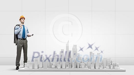 Businessman looking at digital construction project of modern city Businessman looking at digital construction project of modern city