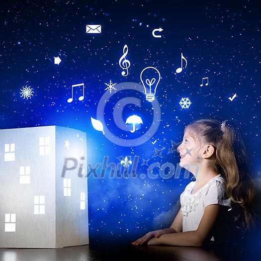 Cute little girl looking at model of house and dreaming Cute little girl looking at model of house and dreaming