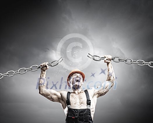 Strong man in uniform tearing metal chain with hands