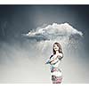 Young pretty woman standing under raining cloud