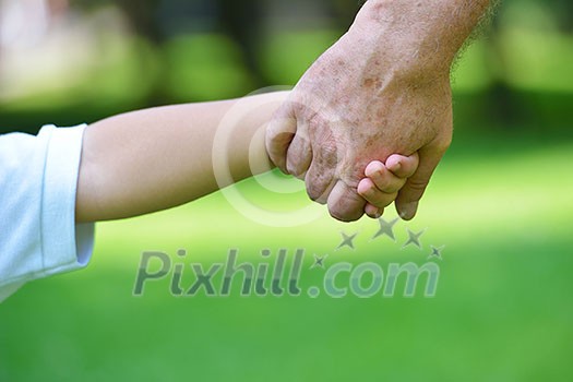 happy grandfather and child have fun and play in park