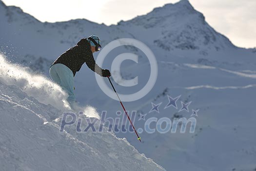 young healthy woman skiing on fresh snow at winter season in france alps young healthy woman skiing on fresh snow at winter season in france alps