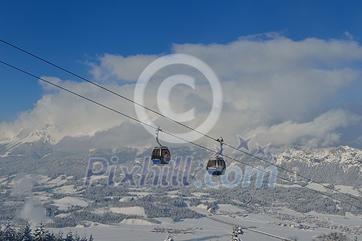 Ski lift gondola in Alps mountains at winter